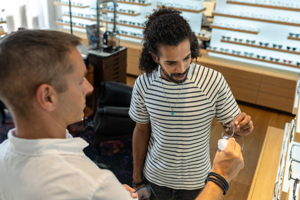 istock A customer buys glasses from an optician 1839023179