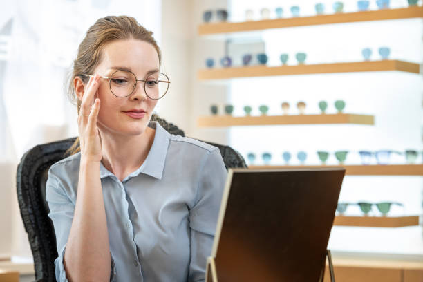 istock A customer buys glasses from an optician 1839024757