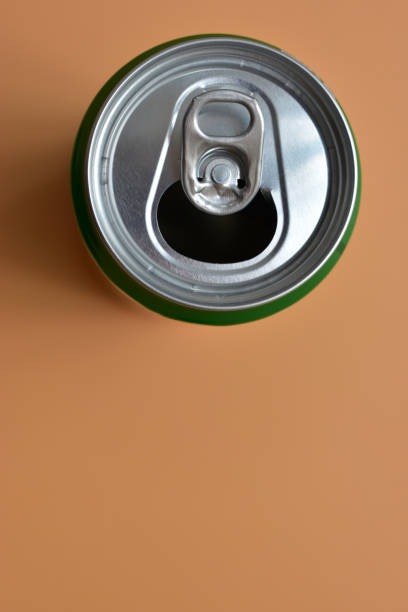 istock aluminum green drink cans on orange background, open cold fresh beverage 1839030837