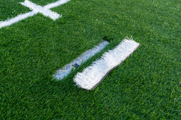 istock Synthetic turf field under construction with lines and graphics being installed. 1839038058