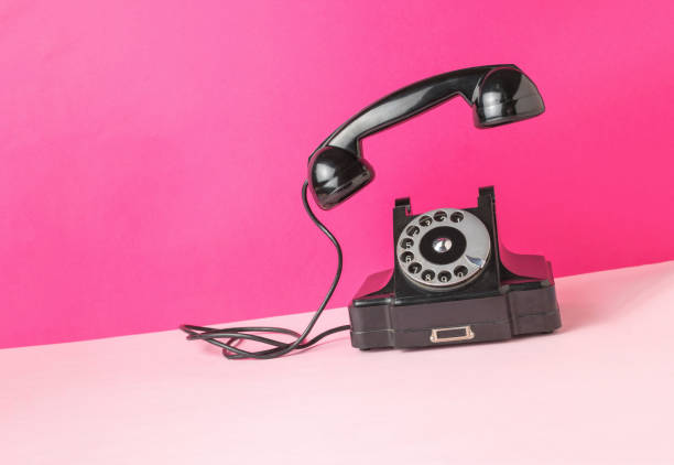 istock Retro phone with the handset off on a two-tone background. 1839054372