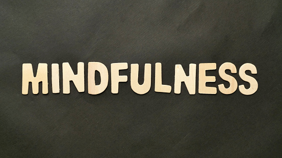 Mindfulness text, written on wooden lettering, balance in life concept
