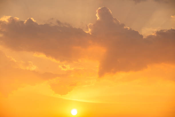 Golden Sky Canvas: A Spectacle of Yellow Hues and Ethereal Clouds.