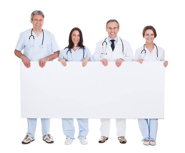 istock Group Of Doctor Holding Placard 183923576