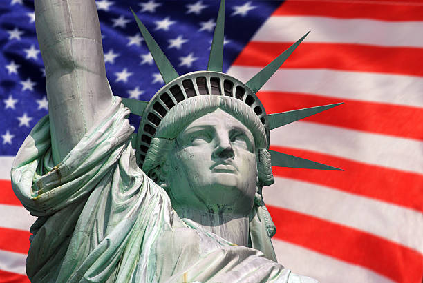 istock Statue of Liberty with US flag 183926938