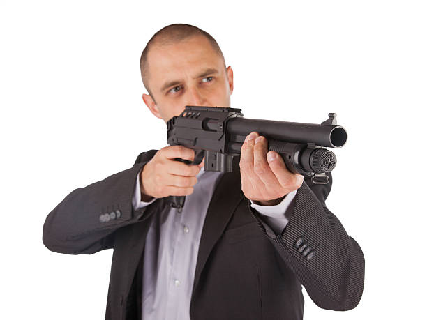 istock Mafia man is holding a shotgun 183931621