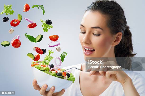 Young Female Tossing Healthy Salad Stock Photo - Download Image Now - 20-24 Years, 20-29 Years, Adult