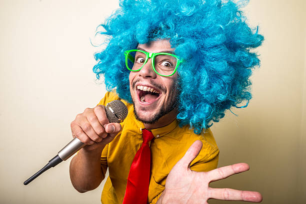 istock crazy funny young man with blue wig 183932283