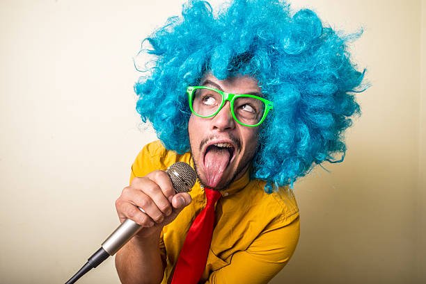 istock crazy funny young man with blue wig 183932294