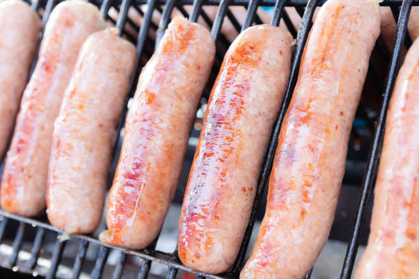 grilled fermented pork sausage on grill stove, Thai food