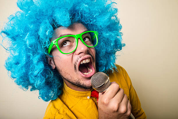 istock crazy funny young man with blue wig 183933542