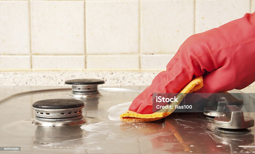 The man cleaning gas stove Cleaning Stock Photo