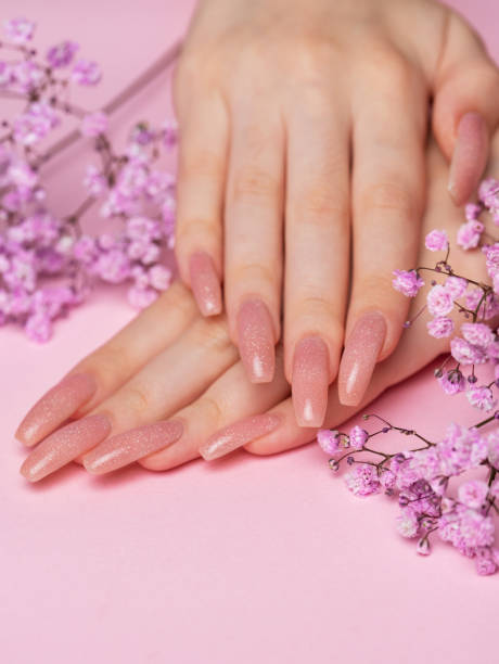 istock Female hands with beautiful manicure on pink background 1839339880