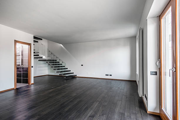 istock Modern room with brown parquet and staircase 183935279