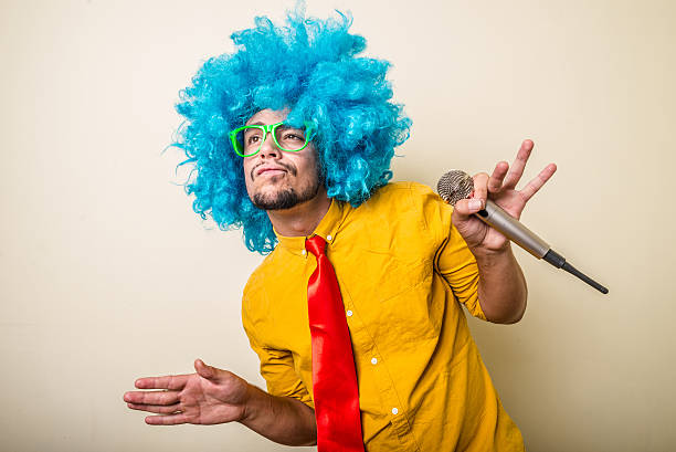 istock crazy funny young man with blue wig 183935282
