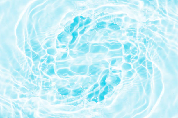 istock Bluewater bubbles on the surface ripples. Defocus blurred transparent white-black colored clear calm water surface texture with splash and bubbles. Water waves with shining pattern texture background. 1839361808