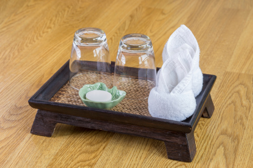 Glass on wooden tray at a spa