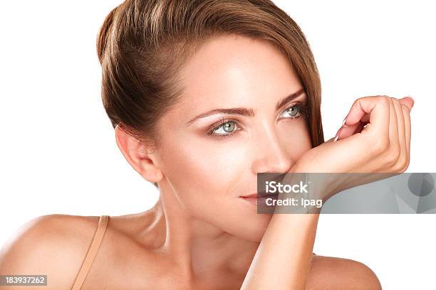 Beautiful Brunette Female Model Smelling Her Perfume Stock Photo - Download Image Now