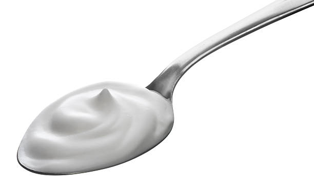 istock spoon of yogurt 183938134