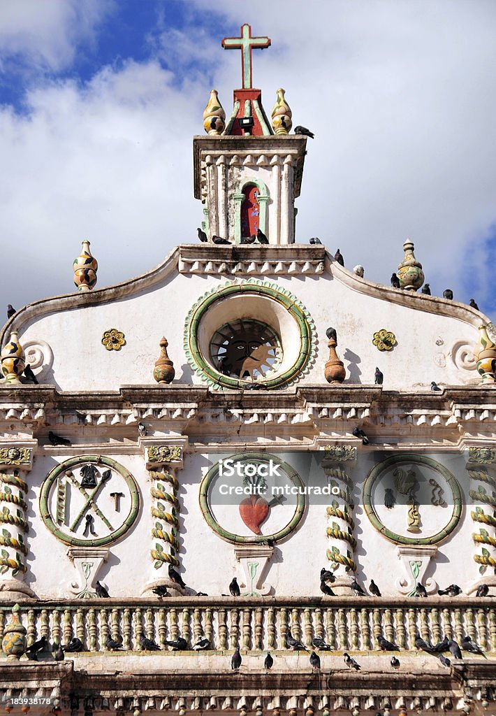 Tegucigalpa, Honduras: gable of Los Dolores church Tegucigalpa, Honduras: sun and sacred heart of Jesus - facade detail of the Dolores church - photo by M.Torres Architecture Stock Photo
