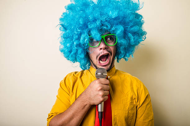 istock crazy funny young man with blue wig 183938380