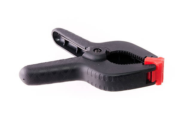 istock Black plastic A-clamp with wooden brick 183939116