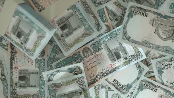 istock 3D rendering of 10000 Afghan afghani notes spread on surface 1839408287