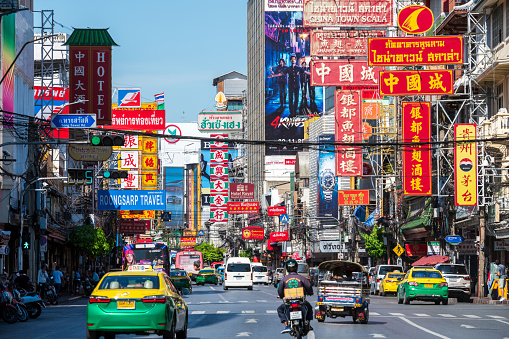 Bangkok, Thailand - September 7, 2023: Yaowarat Road with Chinese signs. Road traffic and walking crowd