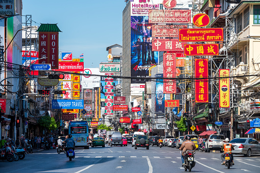 Bangkok, Thailand - September 7, 2023: Yaowarat Road with Chinese signs. Road traffic and walking crowd