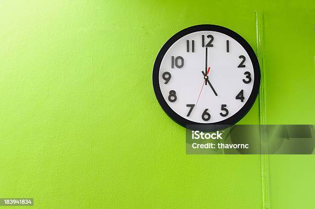 Clock Showing 5 Oclock On A Green Wall Stock Photo - Download Image Now - 16-17 Years, Alarm Clock, Black Color