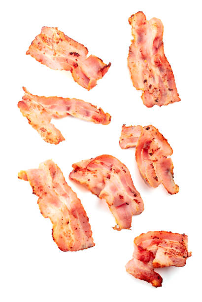 istock Fried bacon slices isolated on white. 1839427260