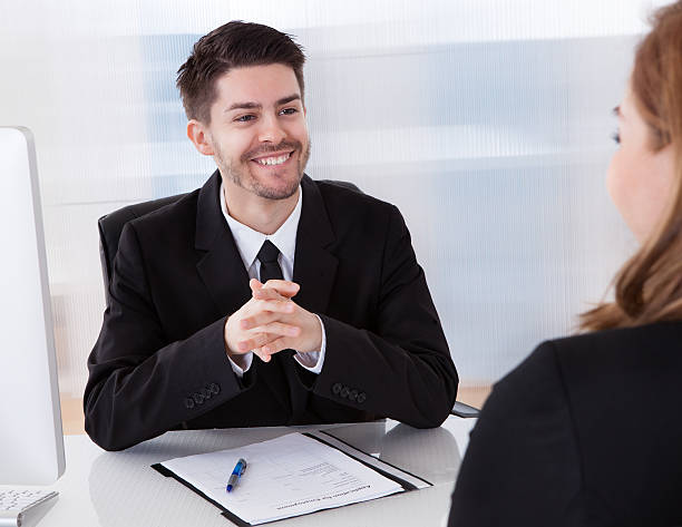 istock Two businesspeople talking with each other 183943847