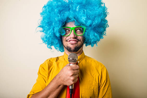 istock crazy funny young man with blue wig 183944137