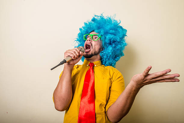istock crazy funny young man with blue wig 183944347