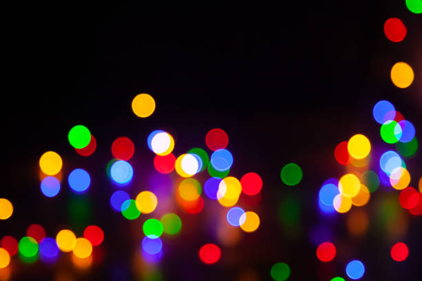 istock Bright round colored highlights are randomly located on black background 1839454367