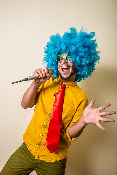 istock crazy funny young man with blue wig 183945829