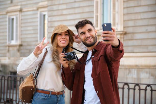 istock Young Caucasian tourist taking a selfie while visiting Madrid, Spain. 1839460141