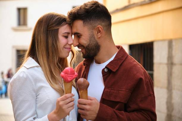 istock Happy young Caucasian couple hugging with ice creams. 1839462793