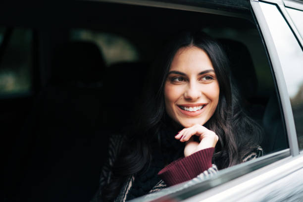 istock Beautiful smiling woman in the cab 1839472825