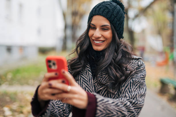istock Stylish young woman in an urban square 1839482321