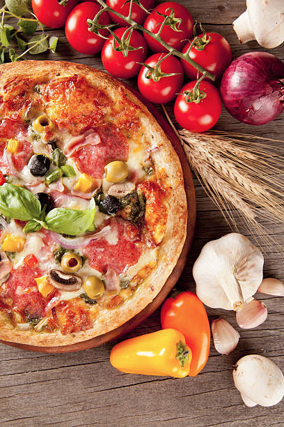 istock Delicious fresh pizza served on wooden table 183948970