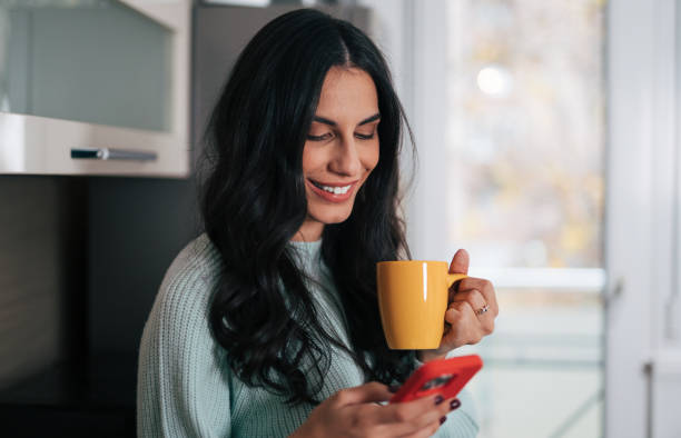 istock Beautiful woman in the kitchen 1839491061