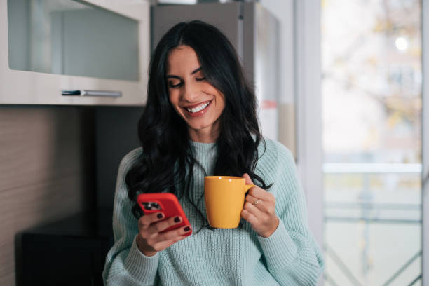 istock Beautiful woman in the kitchen 1839491580