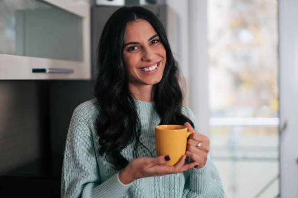 istock Beautiful woman in the kitchen 1839499364