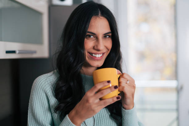 istock Beautiful woman in the kitchen 1839499368