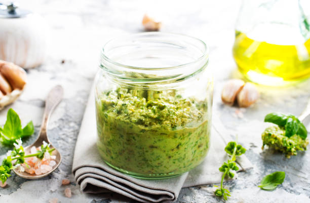 istock pesto sauce in glass jar, sauce from basil 1839500934