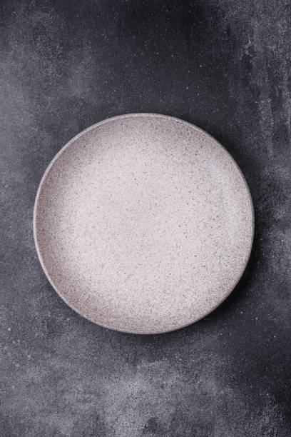 istock Empty round ceramic plate as an item of kitchen utensils 1839523823