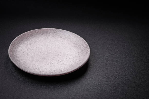 istock Empty round ceramic plate as an item of kitchen utensils 1839530767