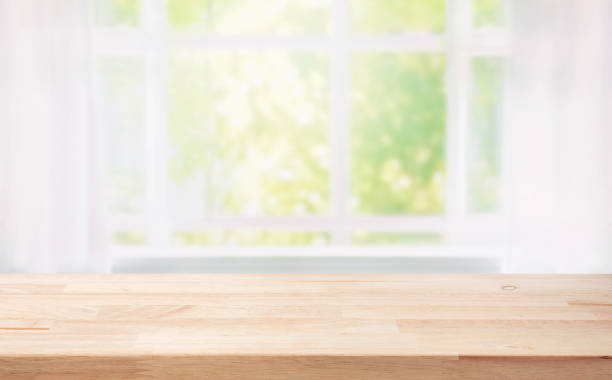 istock Selective focus.Wood table counter on blur curtain window in morning background 1839530776