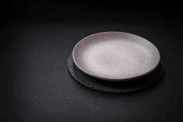 istock Empty round ceramic plate as an item of kitchen utensils 1839532863